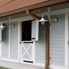 grey and white wood-panelled stables